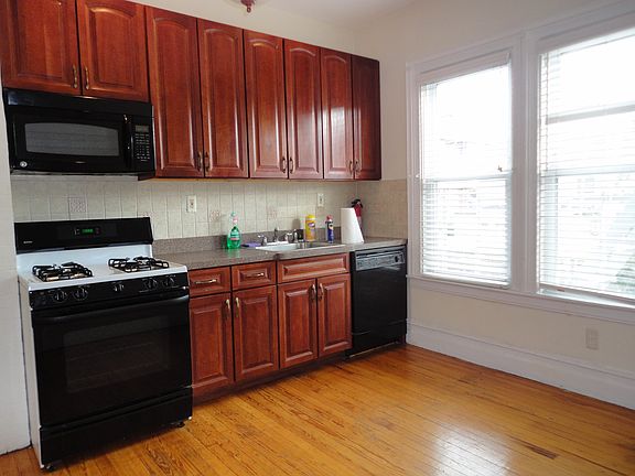 mod kitchen dishwasher gas stove, microwave and refrigerator