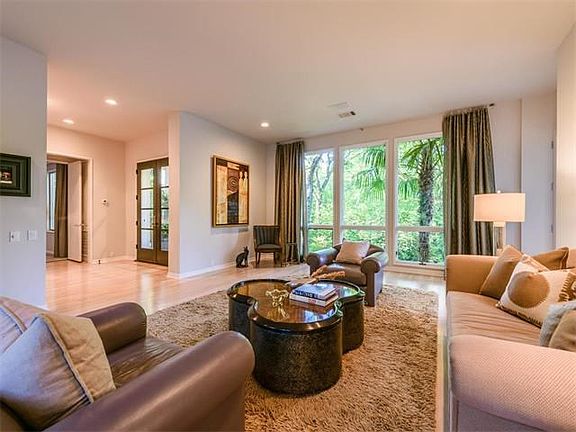 Formal Living area with floor to ceiling windows in front and back.