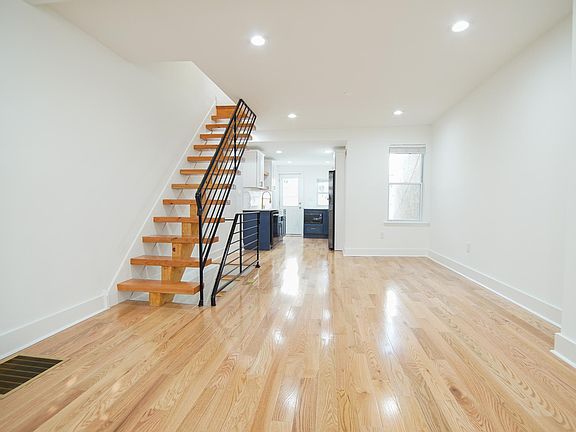 Hardwood flooring, recessed lighting and ample natural light