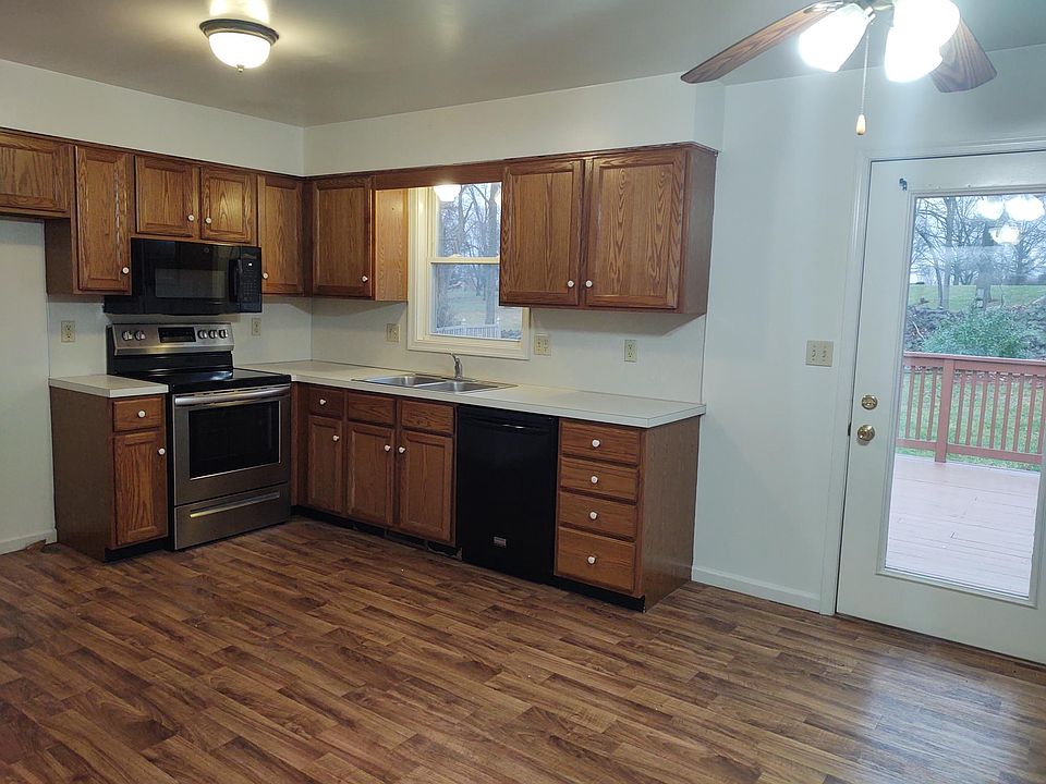 Beautiful kitchen with updated flooring, stove, microwave, & dishwasher.