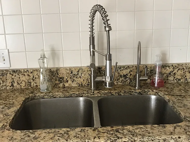 Stainless steel double bowl sink with built in Pure Water Filter System.