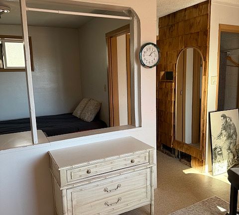 Kitchen area looking into bedroom area.
