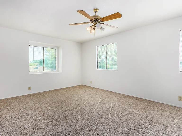 View of upstairs (primary) bedroom #3. New paint and flooring. Features double closets.