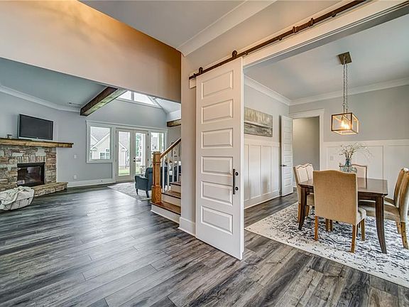 Image 5: 8' Barn Doors Highlight the Dining Room