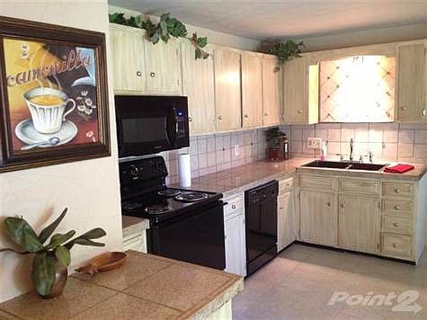 Open spacious kitchen with beautiful cabinetry.