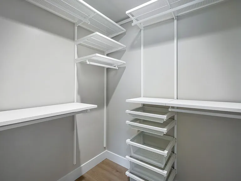 Walk in closets with built in storage at each bedroom