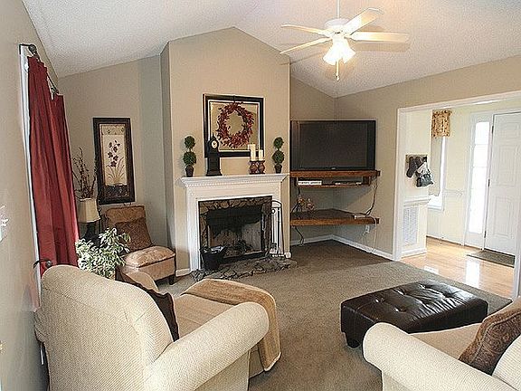 Neutral paint throughout this home. Cathedral ceiling in the family room.