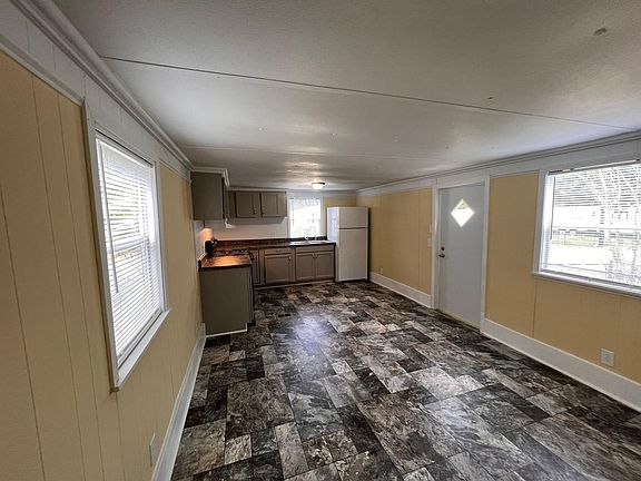 Large living room and dinning room. With central air and heat. It comes with a refrigerator and stove.