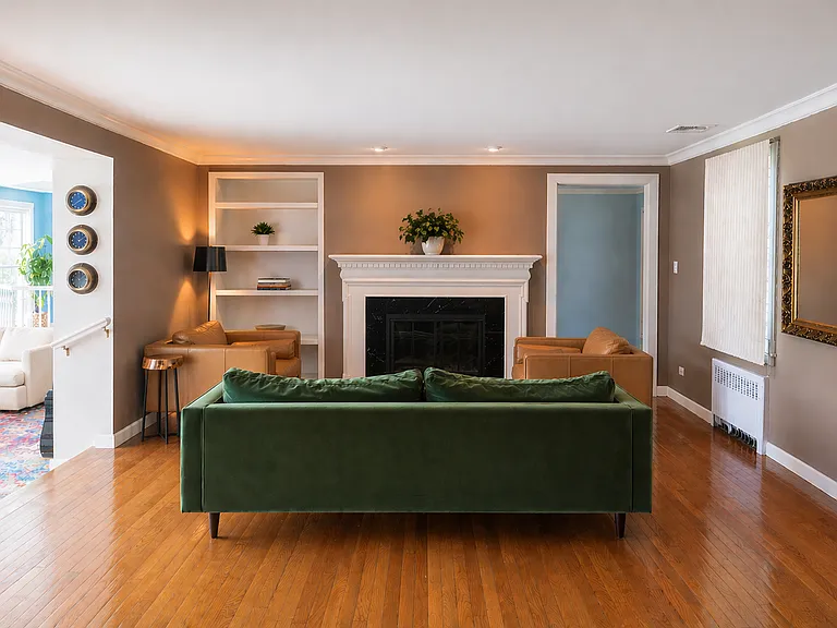 Cozy formal living room with wood burning fireplace.