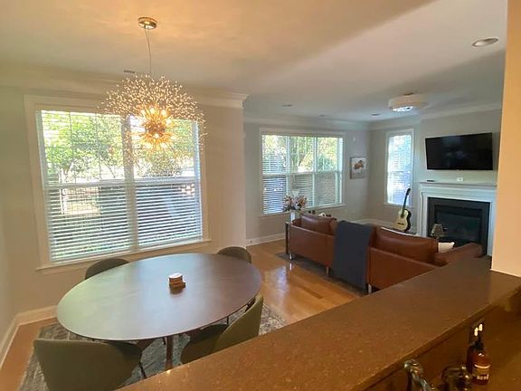 View of dining area and living room from the kitchen