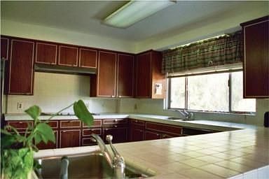 Spacious kitchen with original cabinetry