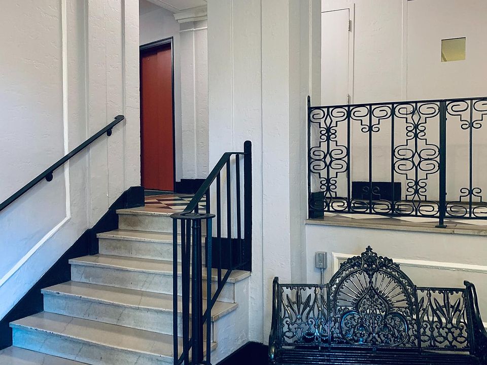 Building foyer with elevator and stairwell access, along with safe package receiving room