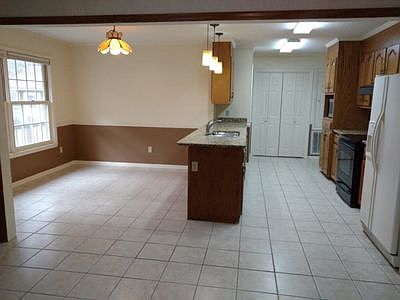 Eat in kitchen with granite.