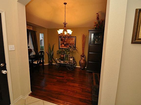 Stunning wood floors and upgraded light fixture. Windows overlook the front yard and cul-de-sac