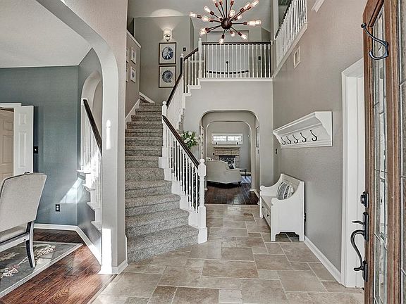 Guests are greeted by the stunning double height entry and grand staircase!