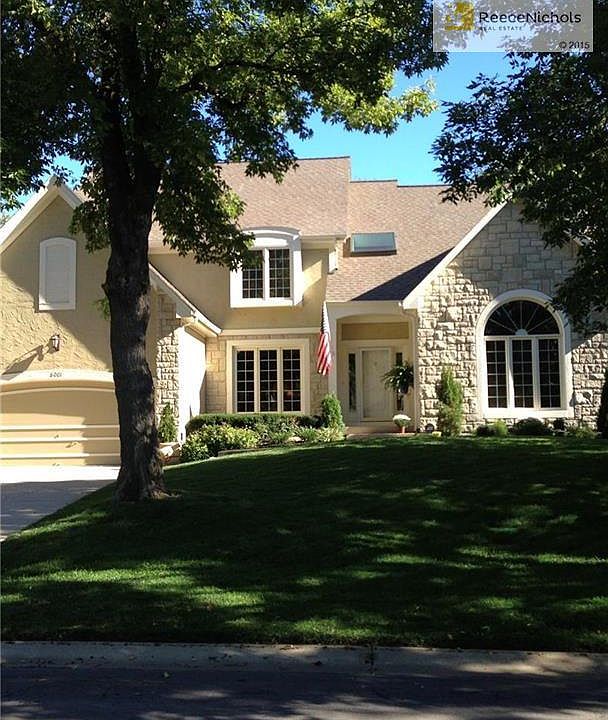 Front view in full summer - lots of dappled shade and mature trees.