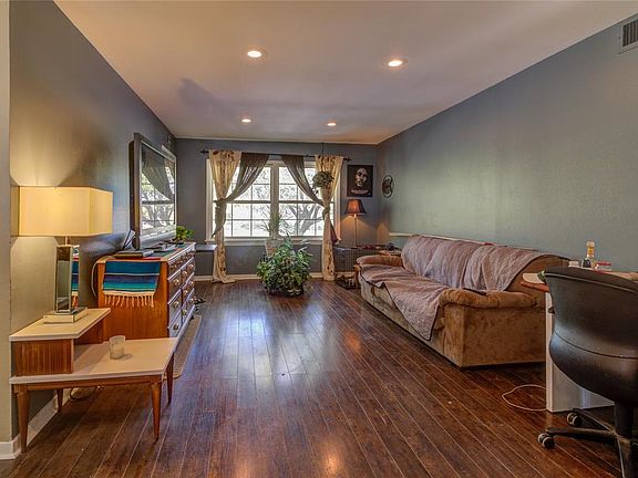 Very spacious living area with beautiful laminate flooring and added skylights make the room shine.