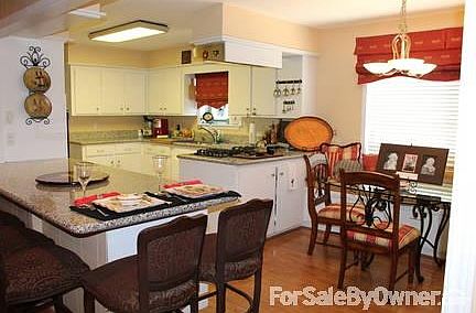 kitchen
						:
						Eat in kitchen with bar and bench seating. Perfect for entertaining.