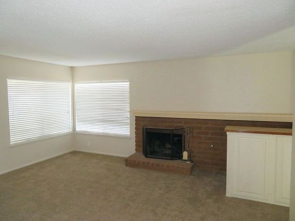 Living room with a brick fireplace
