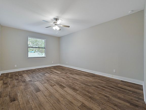 This spacious master bedroom is the perfect place to relax after a long day