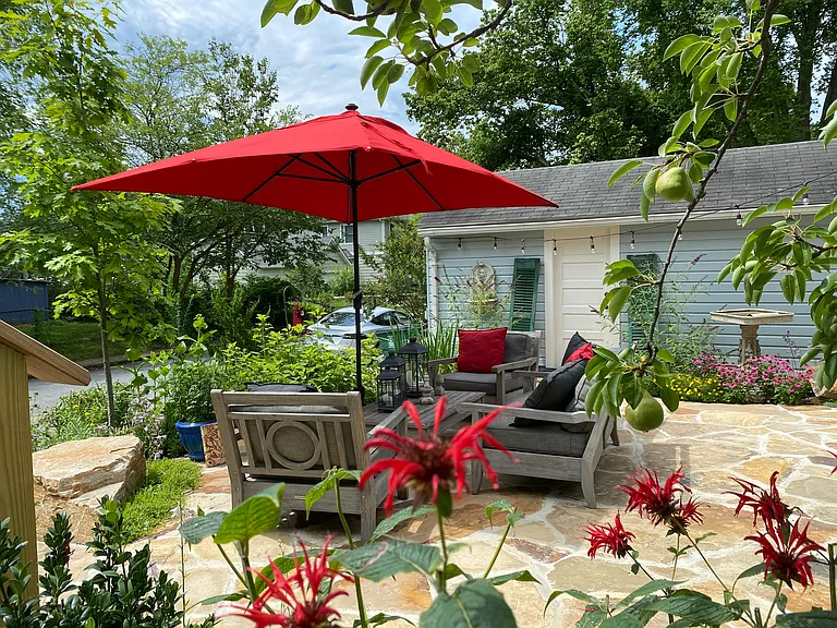 Just off the dining deck is the comfortable and inviting custom stone patio.