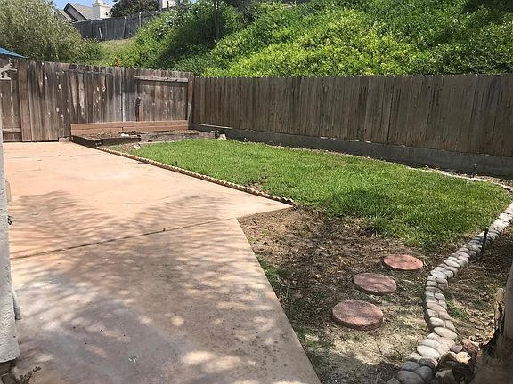 Fenced backyard and patio