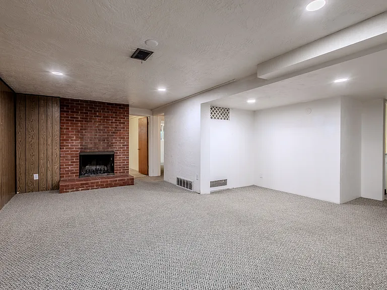 Retro wood paneling, new vinyl windows, recessed lighting, great space.