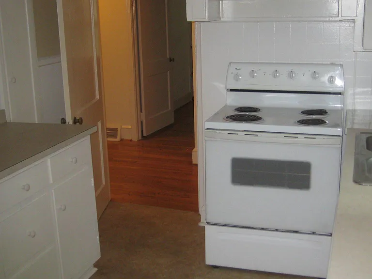 Kitchen with door to hall