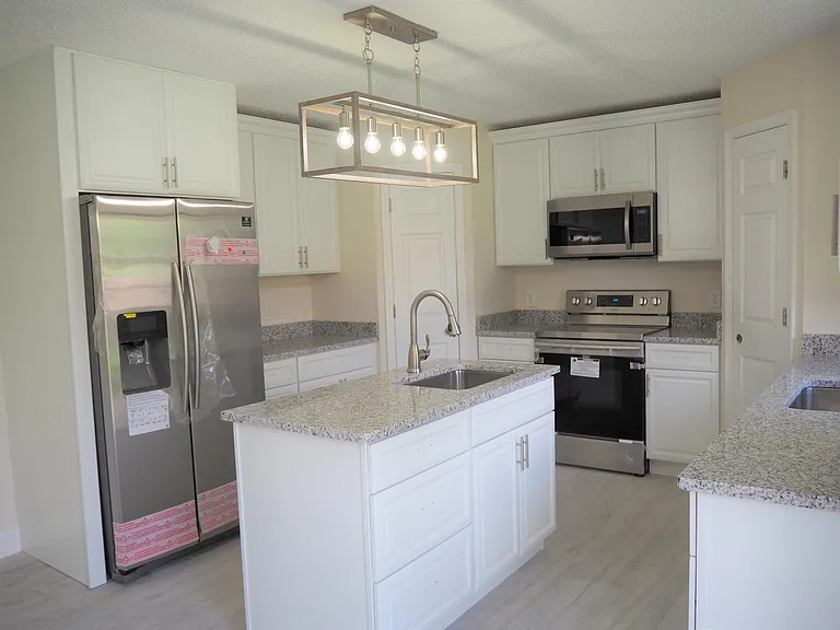 Granite counters and 2 sinks.