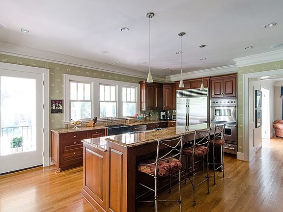 Fabulous chefs kitchen with custom cherry cabinets, top fo the line SS appliances and granite counters