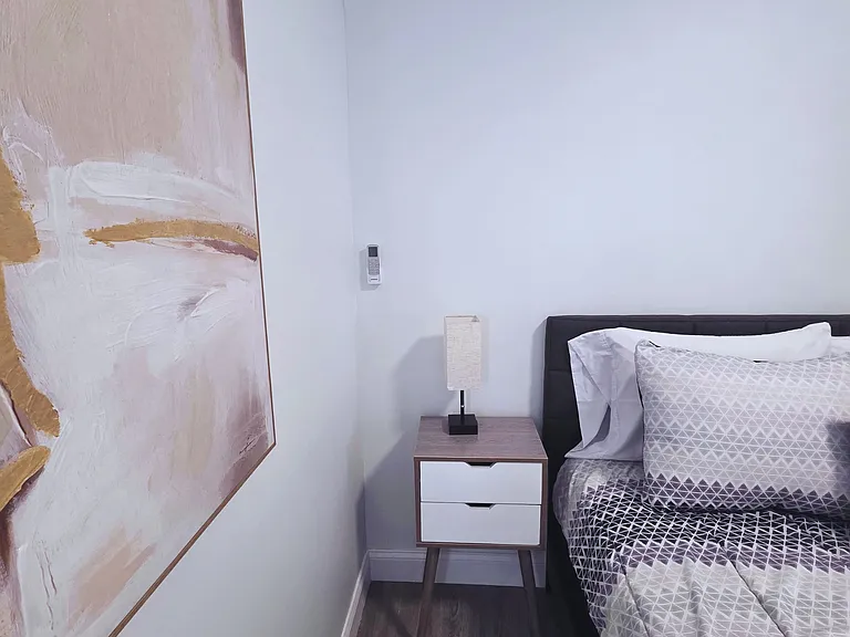 Queen bed with premium linens and pillows for a great night's rest