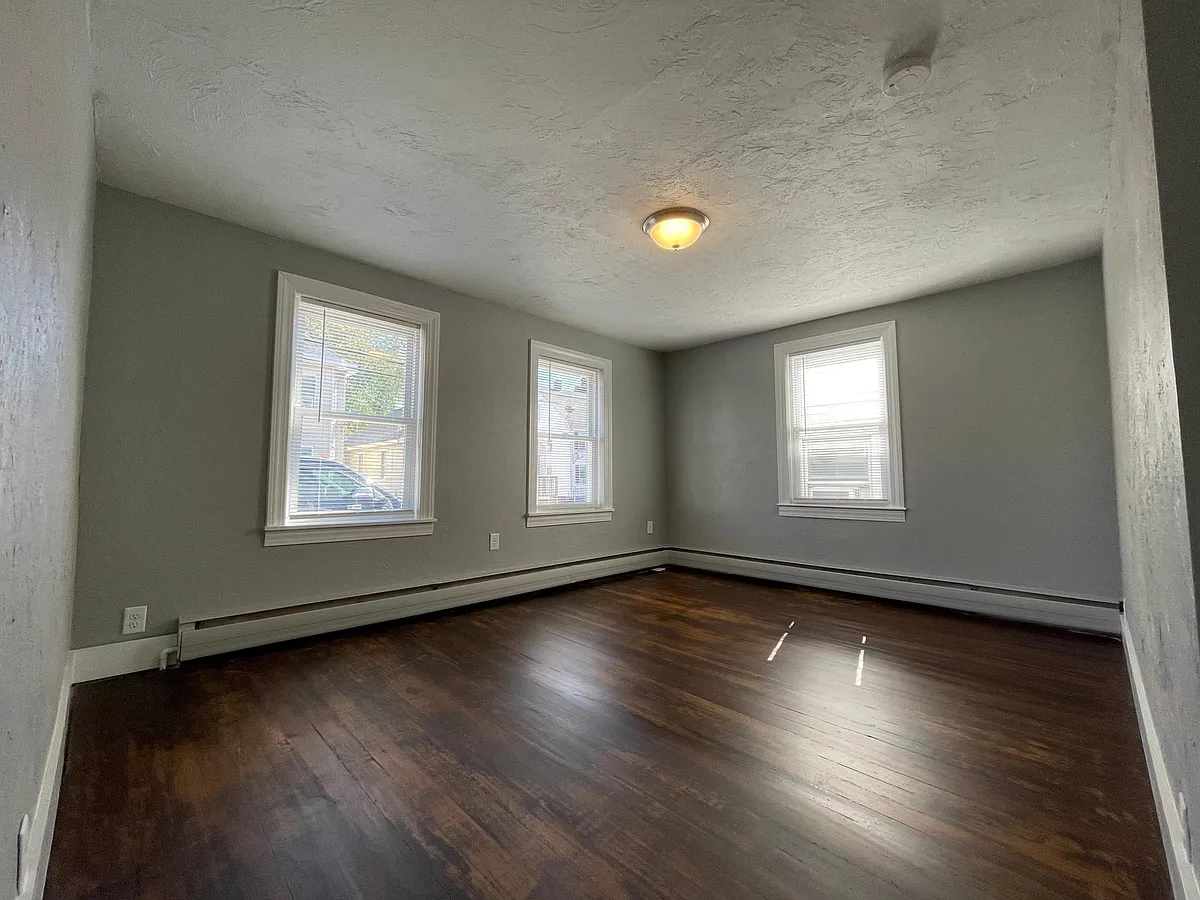 Living Room with Refinished Floors Lots of Natural Light (Front of House) - 42 E Main St #1