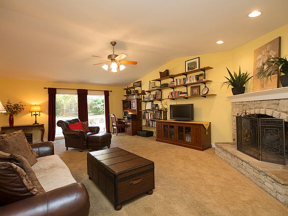 Vaulted Family Room with new stacked stone gas fireplace and recessed lighting.