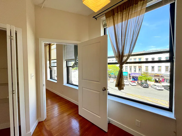 Second bedroom oversized window facing Main St.