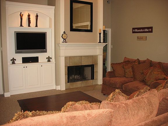 Spacious living room includes a built-in entertainment center.