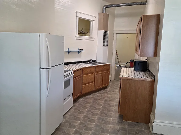 Eat-in dining area leads to galley style kitchen