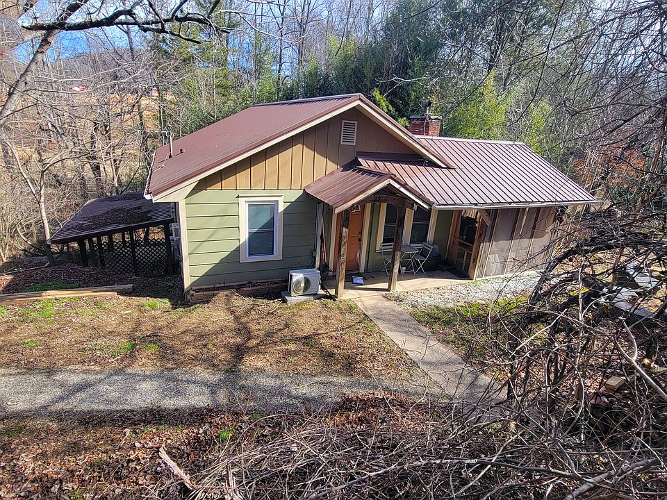 House viewed from the street. Mellow, mature downstairs tenant has their own stairs, path, and entrance down on the left side of the house.
