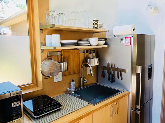 Refrigerator with water filter and automatic ice maker. Landlord replaces filter every 6 months.