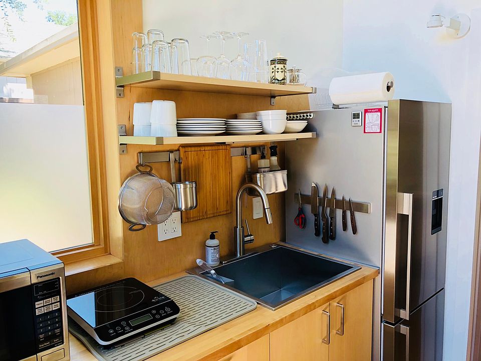 Refrigerator with water filter and automatic ice maker. Landlord replaces filter every 6 months.