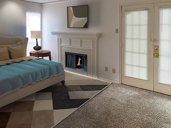 Bedroom with wood burning fireplace