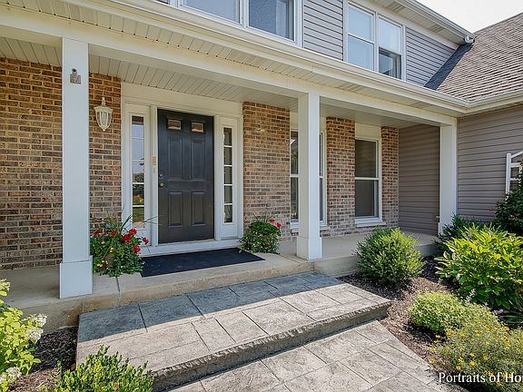 Relax and enjoy the outdoors on the large front porch.