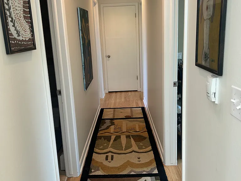 Hallway off main living to 3 bedrooms, 2 baths