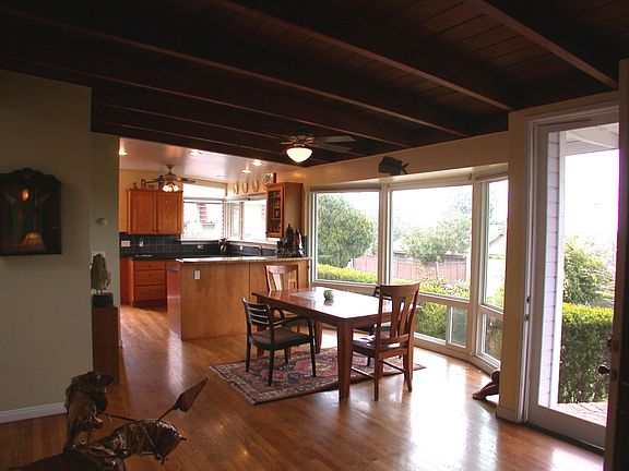 Dining Room w/Hardwood Floors & Oversized Windows