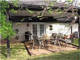 Back yard includes small covered patio