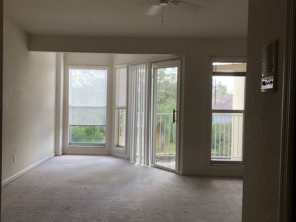Master bedroom with patio overlooking the water with boat dock.