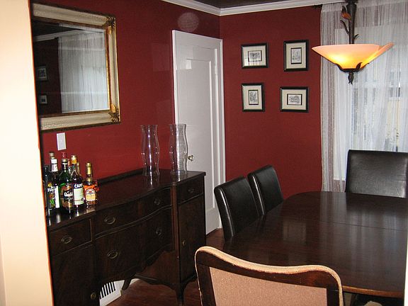 Dining room with original wood floors and crown moulding