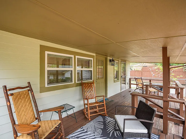 Enjoy some relaxing in the back porch rocking chairs