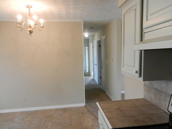 Kit looking down hallway