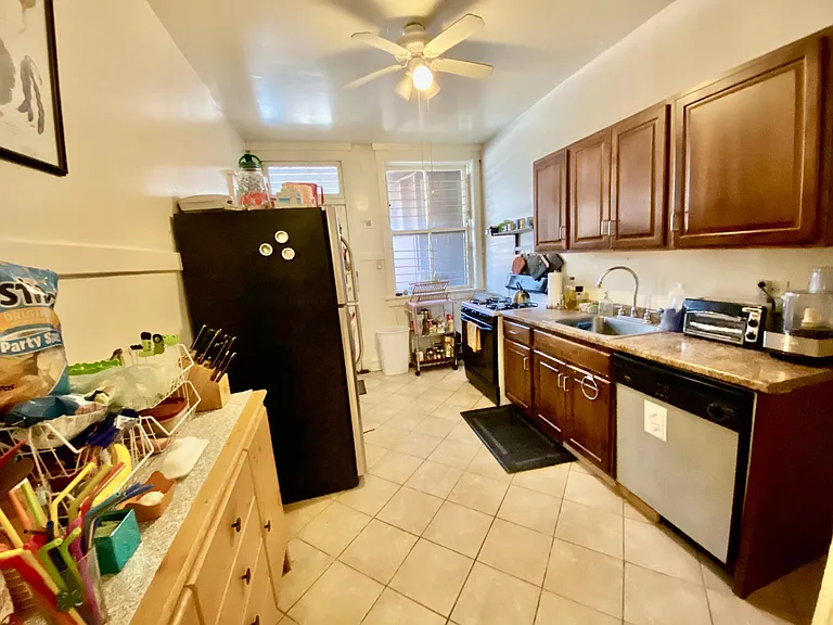 Spacious kitchen with 2 large pantries, space for small table/breakfast bar/additional storage pieces. Some stainless appliances, dishwasher, wood cabinets