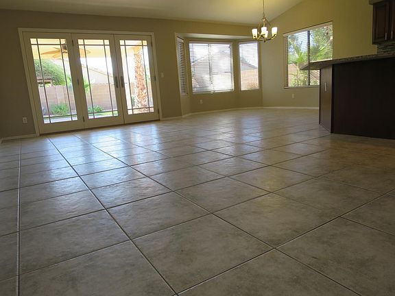 Plenty of open space for table, stools, sectional, armchairs.